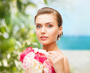 Image showing woman holding flowers