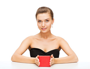 Image showing woman with diamond earrings and gift box