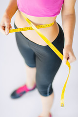 Image showing trained belly with measuring tape