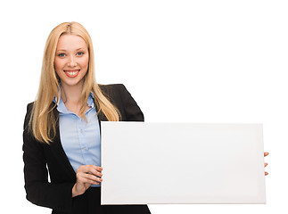 Image showing businesswoman with white blank board