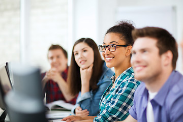 Image showing students with computers studying at school