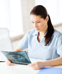 Image showing doctor or dentist looking at x-ray