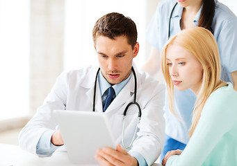 Image showing doctor and nurse with patient in hospital