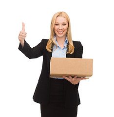 Image showing businesswoman holding cardboard box