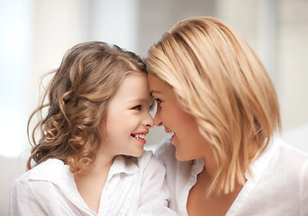 Image showing mother and daughter cuddling