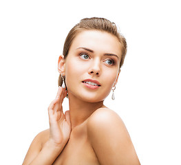 Image showing woman wearing shiny diamond earrings