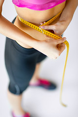 Image showing trained belly with measuring tape