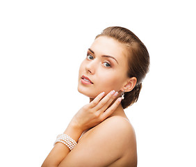 Image showing beautiful woman with pearl earrings and bracelet