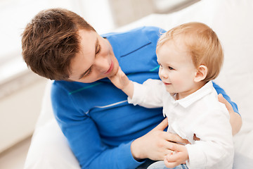 Image showing happy father with adorable baby