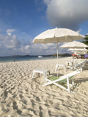 Image showing Chairs and parasols on the beach