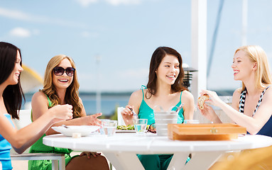 Image showing girls in cafe on the beach