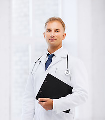 Image showing male doctor with stethoscope and notes