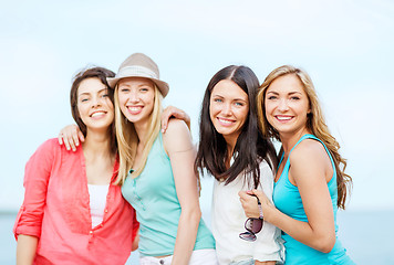 Image showing group of girls chilling on the beach