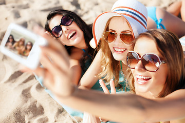 Image showing girls making self portrait on the beach