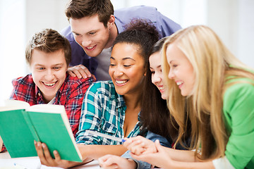 Image showing students reading book at school