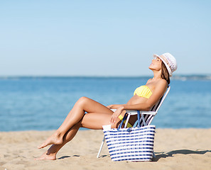 Image showing girl sunbathing on the beach chair