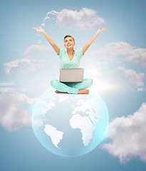 Image showing woman with laptop and sphere globe