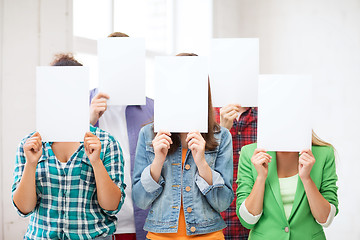 Image showing students covering faces with blank papers