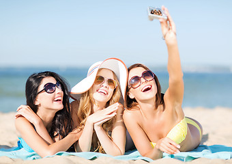 Image showing girls taking self photo on the beach