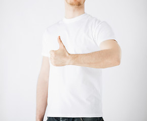 Image showing man showing thumbs up