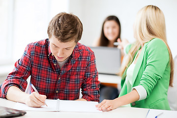 Image showing students writing something at school