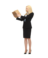 Image showing attractive businesswoman holding cardboard box