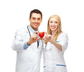 Image showing doctors cardiologists with heart