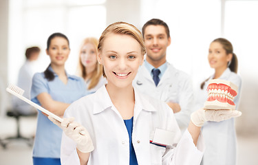 Image showing doctor with toothbrush and jaws