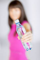 Image showing sporty woman with bottle of water