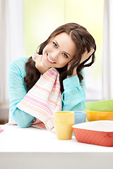 Image showing lovely housewife at the kitchen