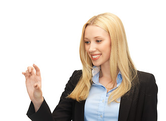 Image showing businesswoman working with something imaginary