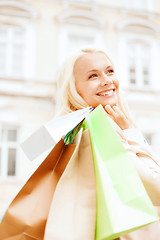 Image showing woman with shopping bags in ctiy