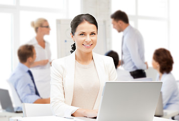 Image showing businesswoman with laptop computer at work