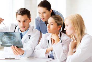 Image showing group of doctors looking at x-ray