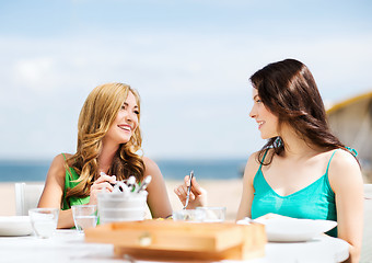 Image showing girls in cafe on the beach