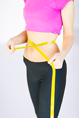 Image showing trained belly with measuring tape