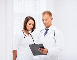 Image showing two doctors writing prescription