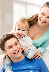 Image showing happy parents playing with adorable baby