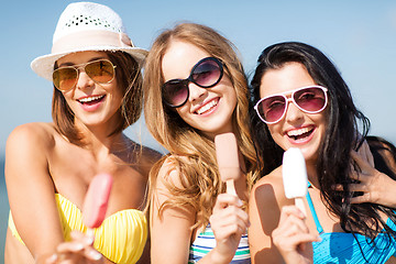 Image showing girls in bikinis with ice cream on the beach