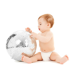 Image showing child playing with disco ball