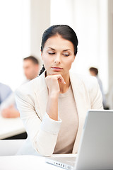 Image showing businesswoman with laptop computer at work