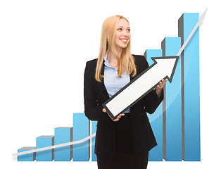 Image showing businesswoman with rising graph and arrow