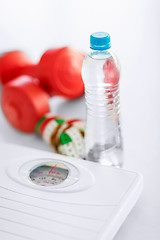 Image showing scales, dumbbells, bottle of water, measuring tape