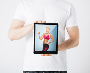 Image showing man with tablet pc and sporty woman