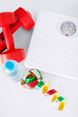 Image showing scales, dumbbells, bottle of water, measuring tape