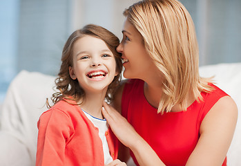 Image showing mother and daughter cuddling