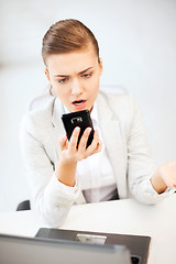 Image showing woman shouting into smartphone