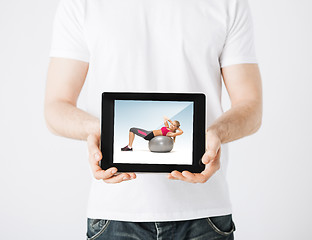 Image showing man with tablet pc and sporty woman
