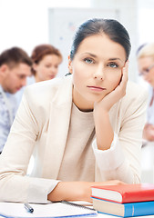 Image showing stressed businesswoman in office