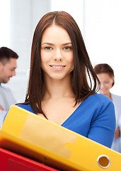 Image showing woman with folders in office